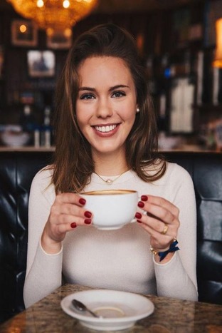girl with veneers smiling with coffee