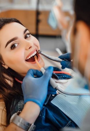 young-female-patient-visiting-dentist-office (1)